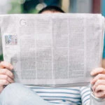 Man reading newspaper