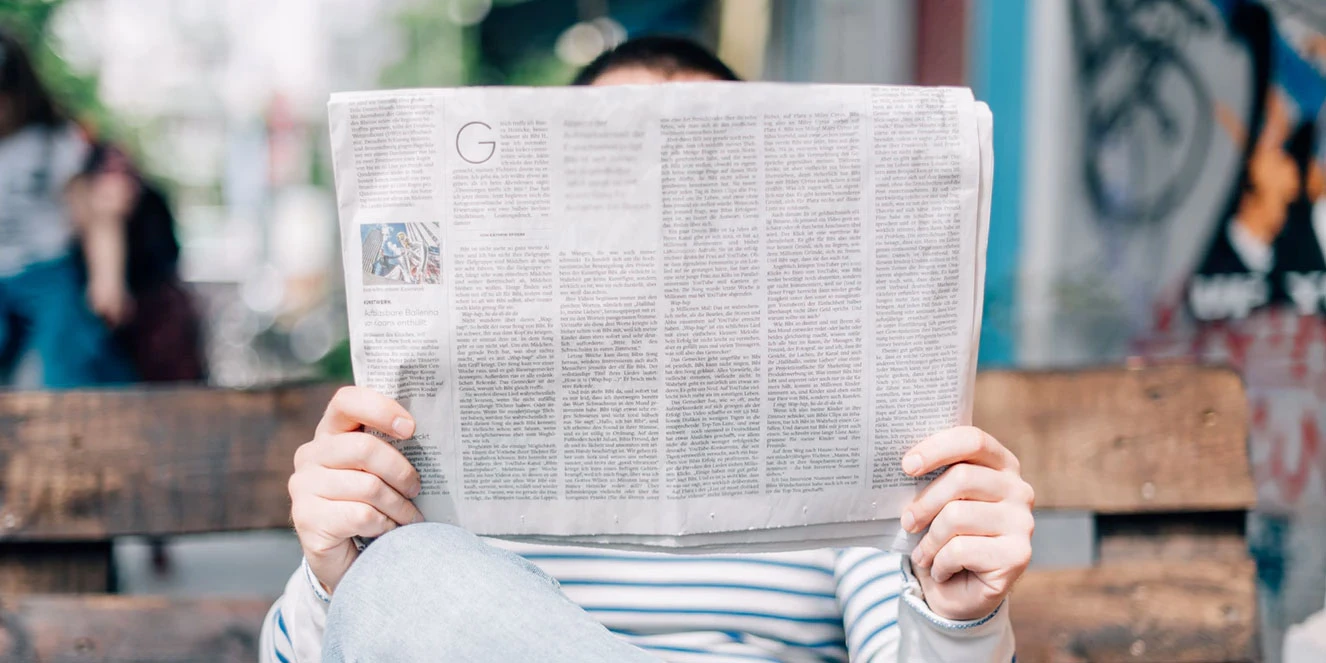 Man reading newspaper