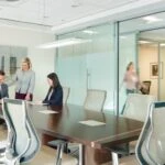 Ellin and Tucker employees in a meeting collaborating.